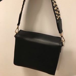 Black mini bag with gold studded strap